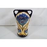 Moorcroft - a Twin handled vase entitled Cornflower, issued in a limited edition 68/100,