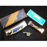 A Swan harmonica model # NH13 - 417, a ECHO - LUXE harmonica made by M.