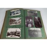 A large album containing in excess of over 200 period postcards
