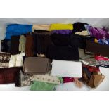 A good lot to include lady's scarves, linen, gloves, handbags and similar.
