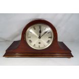 A mahogany cased mantel clock with pendulum