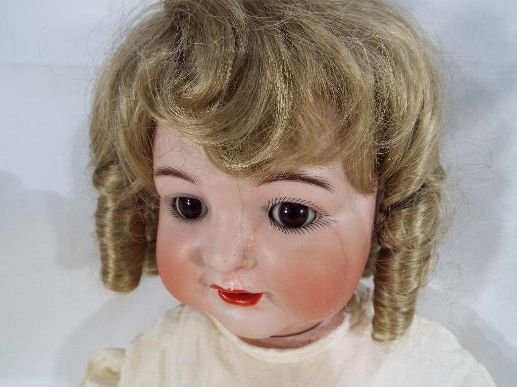 Kammer & Reinhardt - a bisque headed dressed doll by Kammer & Reinhardt with sleeping glass eyes, - Image 6 of 6