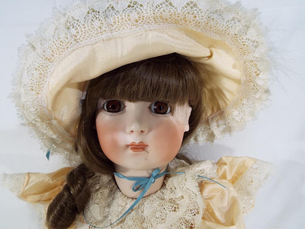 Cabinet Doll - a bisque headed cabinet size dressed doll with glass eyes, - Image 2 of 4