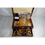 A lady's faux leather jewellery box containing a quantity of good quality costume jewellery