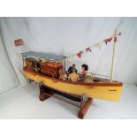 A scratch built battery powered pond yacht (untested) named Skylark on a wooden stand approx 36cm x