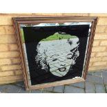 A large wood framed wall mirror depicting Marilyn Monroe approx 71cm x 68cm