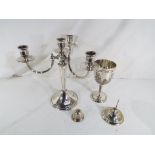 A good quality silver plated four branch candelabra 25 cm (h) and a silver plated goblet with