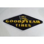 A cast iron sign advertising Goodyear Tyres,