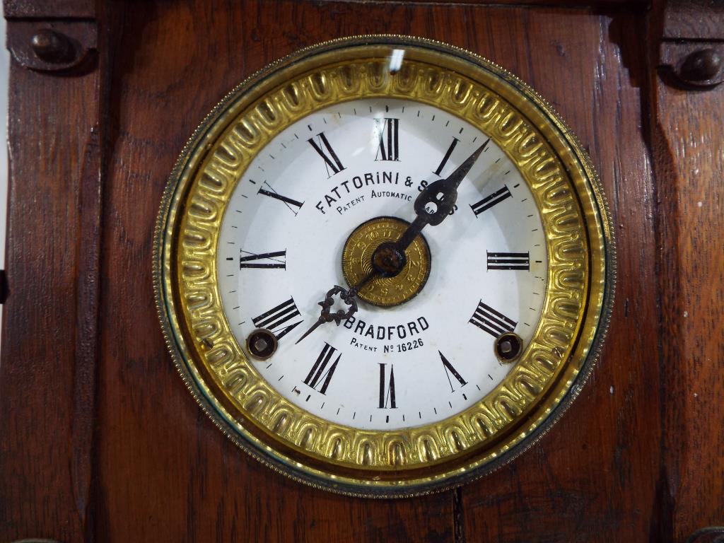 An oak cased table alarm clock by Fattorini and Sons, Bradford, - Image 2 of 3