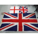 A large Union Flag measuring approx 90cm x 175cm and two smaller flags (3)