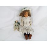 Kammer & Reinhardt - a Kammer & Reinhardt dressed doll with celluloid head, jointed body,