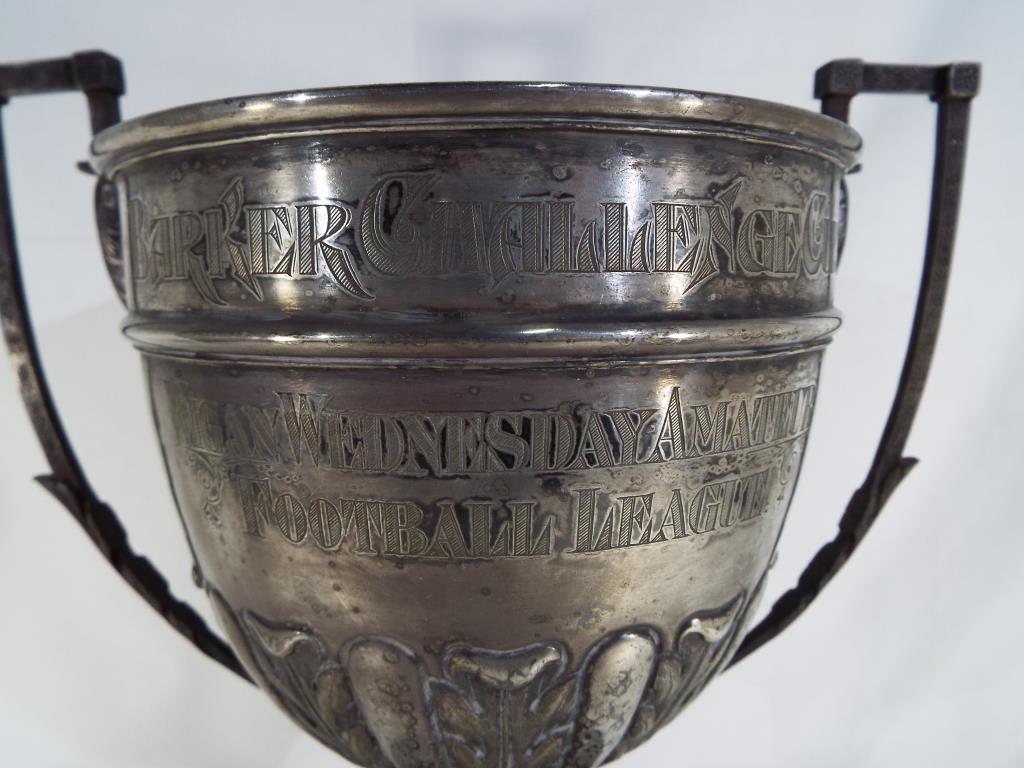 A vintage twin handled trophy with foliate decoration on an ebonised base engraved Barker Challenge - Image 2 of 2