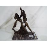 An art deco style figurine depicting a pair of dancers, the sulpture impressed Chiparus,