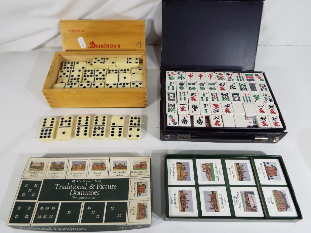 A small quantity of games to include a double nine set of dominoes with spinners in case,