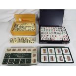 A small quantity of games to include a double nine set of dominoes with spinners in case,