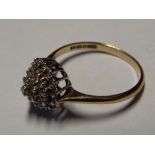 A lady's 9 carat yellow gold diamond cluster ring size O, approximate weight 2.19 grams.