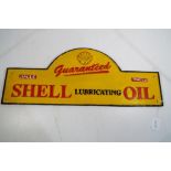 A cast iron sign advertising Shell,