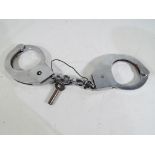 A pair of police handcuffs.