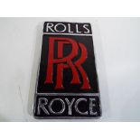 A chrome wall plaque advertising Rolls Royce Est £30 - £50