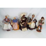 Four French Stanton terracotta costume dolls the largest approx 26cm (h) and similar