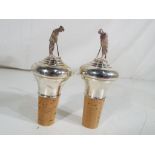 Two silver hallmarked bottle stoppers in the form of golfers,