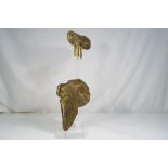 An unusual brass sculpture on a perspex stand which is signed,