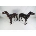 A pair of cast bronzed greyhounds,