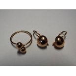 A pair of 14 carat gold earrings and a 14 carat gold ring all stamped 585, approximate weight 5.