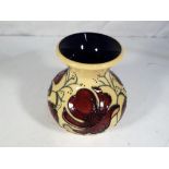 Moorcroft Pottery - a Moorcroft Pottery vase decorated in the Cosmos pattern approx 10cm (h) Est