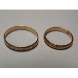 A pair of His and Hers 14 carat gold matching wedding bands, lady's ring stamped clearly 585,