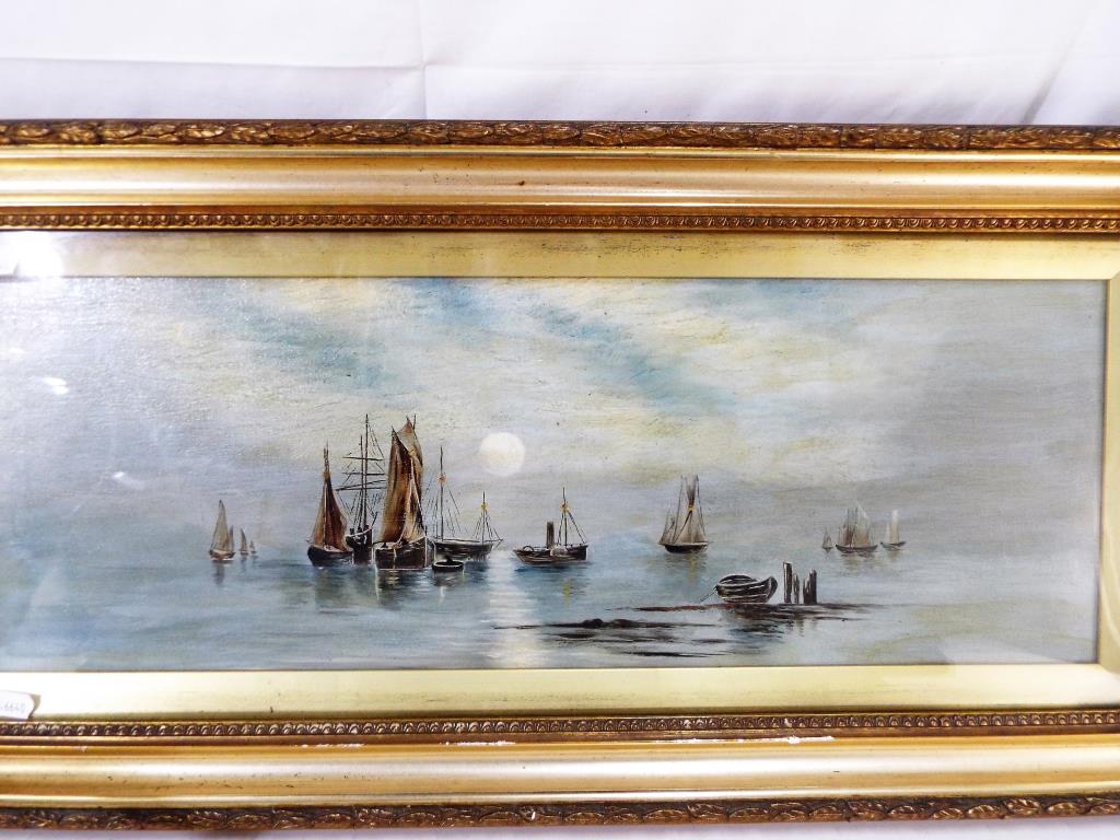 A framed and glazed oil on canvas depicting maritime scene approximately 19 cm x 55 cm image size.