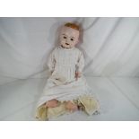 Heubach Koppelsdorf - an antique character dressed doll by Heubach Koppelsdorf with glass sleeping