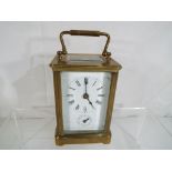 A good quality French 8-day carriage clock, brass case with bevelled glasses,