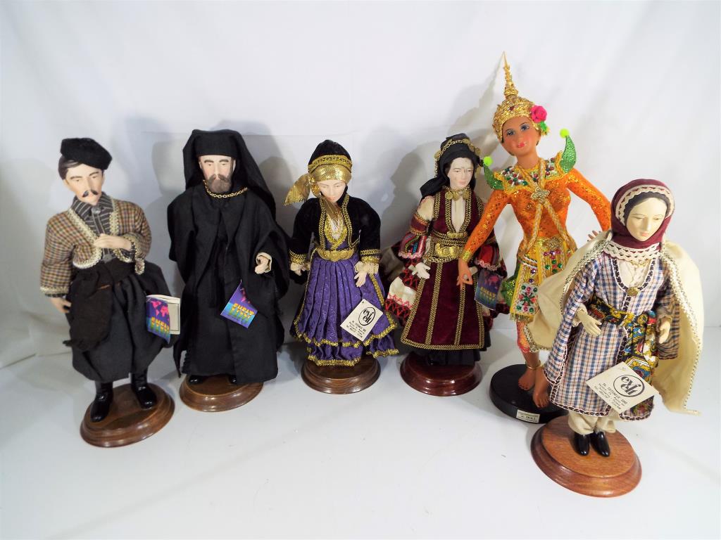 Five porcelain dolls by Evelt dressed in traditional Greek costume and a further doll by SR Dolls,