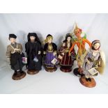 Five porcelain dolls by Evelt dressed in traditional Greek costume and a further doll by SR Dolls,