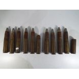 Eleven 33mm cannon shells