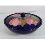 Moorcroft Pottery - a large Moorcroft Pottery round lidded powder bowl decorated with magnolia on a