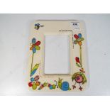 Moorcroft Pottery - a Moorcroft Pottery ceramic photo frame in the Stitch in Time pattern stamped