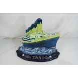 A large cast iron door stop depicting the Titanic, approx 26cm x 32cm x 9cm,