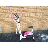 Fitness Equipment - an Active Woman cross trainer,