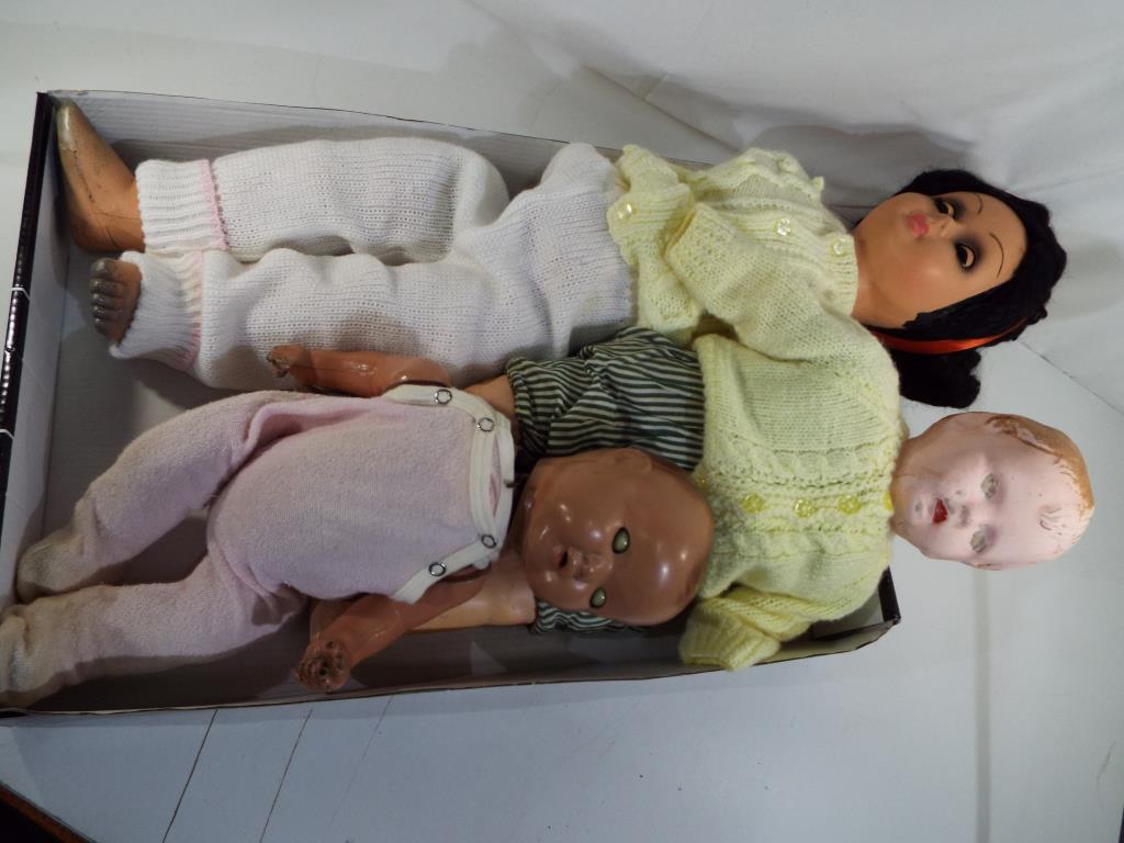 Vintage dolls - a composition doll with sleeping eyes, open mouth, jointed limbs (head loose),