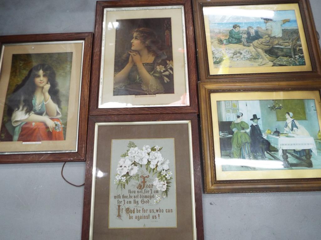 Five framed pictures of varying sizes