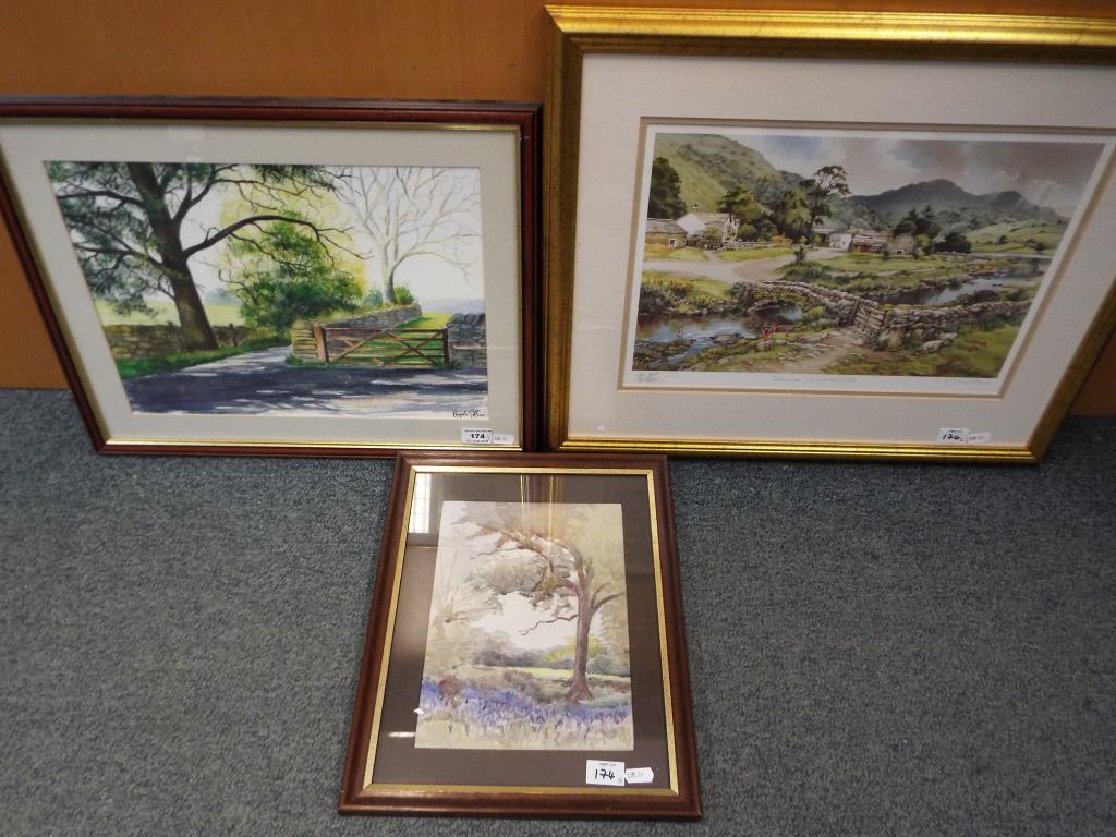 A watercolour mounted and framed under glass depicting a rural scene signed lower right by the