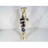 Moorcroft Pottery - a large Moorcroft Pottery slim line vase decorated with blue bells stamped to