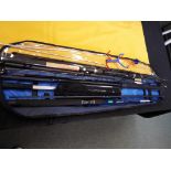 Angling - a rod bag containing a telescopic landing net, two rod rests, a bait catapult,
