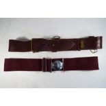 A Parachute Regiment belt and buckle along with a further belt.