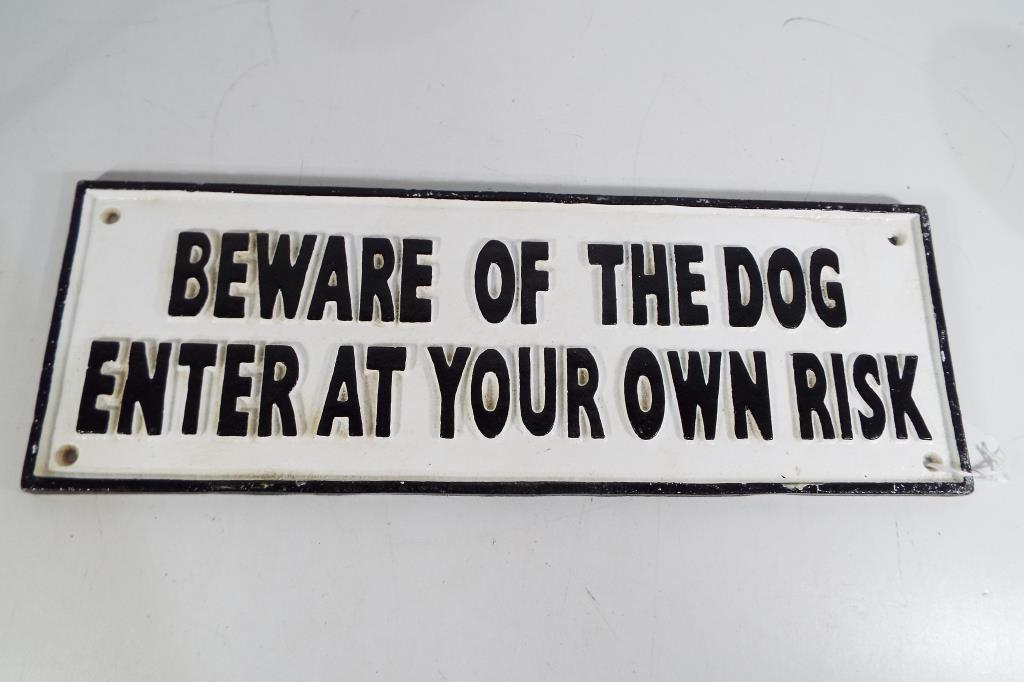 A cast iron sign Beware of the Dog,