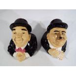 Kevin Francis Ceramics - two boxed face pots by Kevin Francis depicting Laurel and Hardy Est £25 -