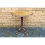 A highly carved oval top occasional table,