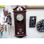 A Hermle wall clock with Westminster chime and pendulum